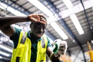 employee struggling under hot working conditions at a warehouse